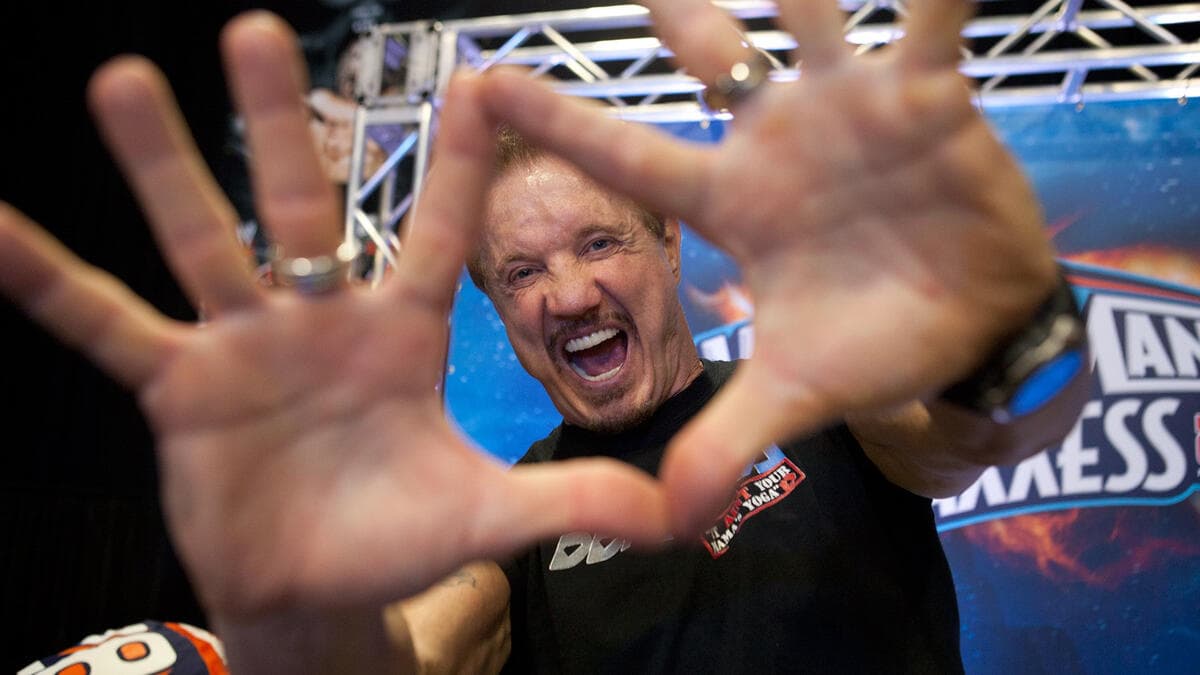 Diamond Dallas Page hits his trademark post at a WWE Axxess event.