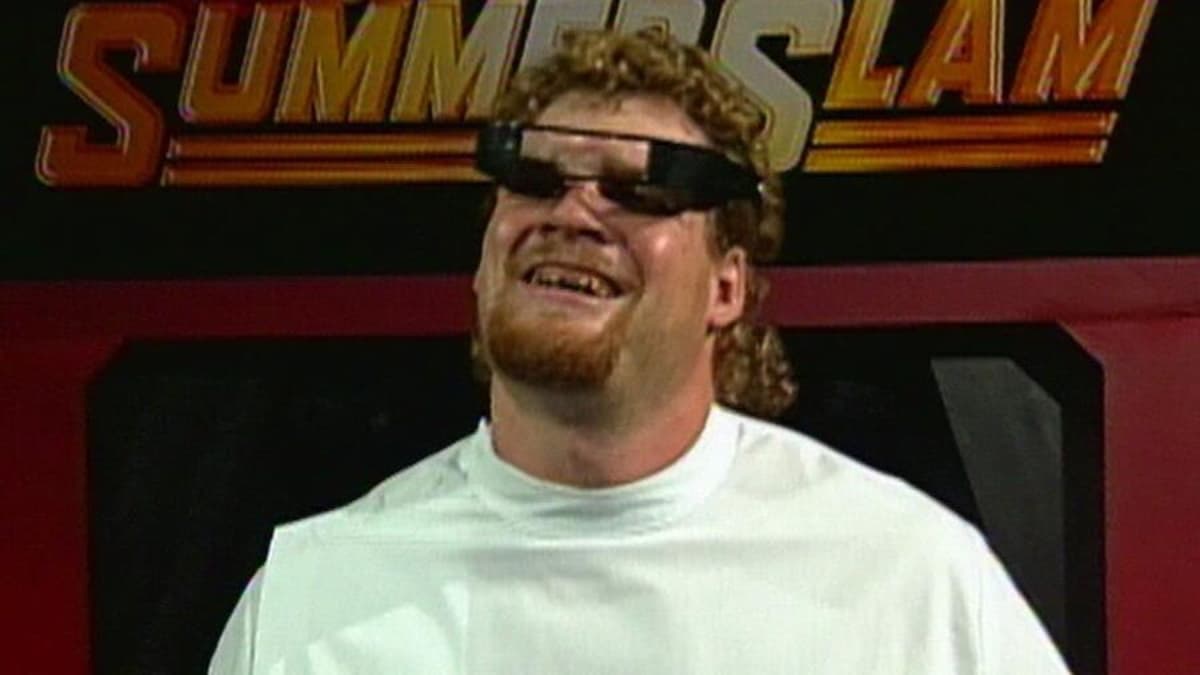 Isaac Yankem DDS with a white t-shirt and black dental glasses