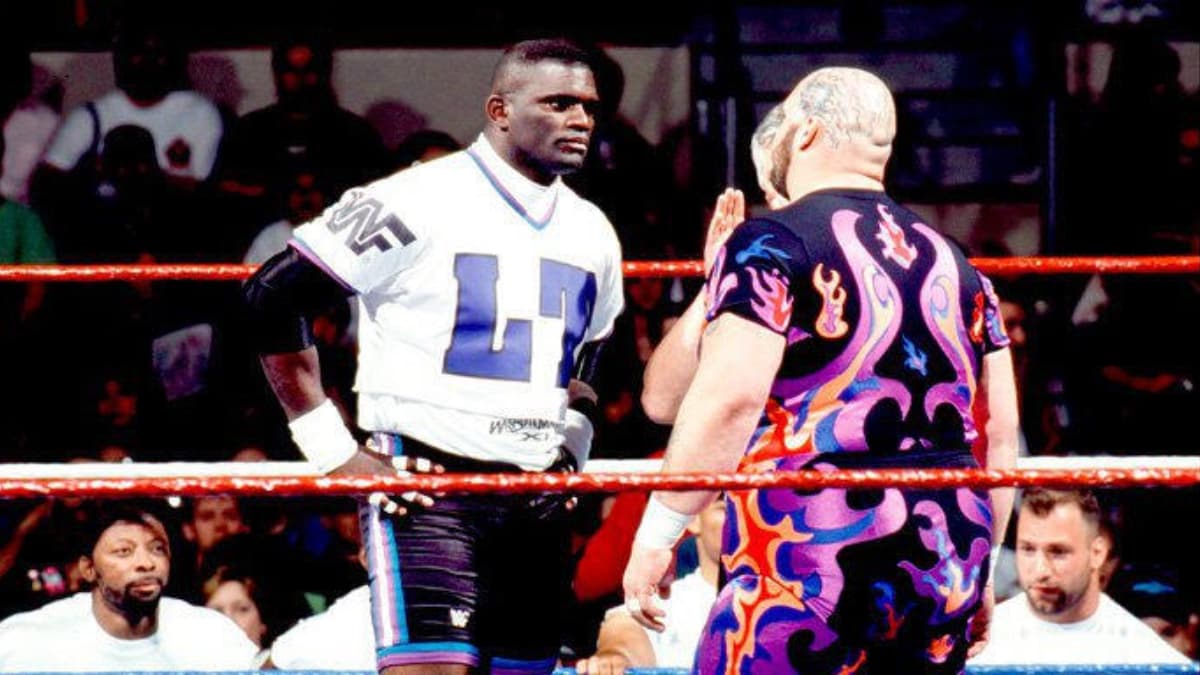 Lawrence Taylor and Bam Bam Bigelow facing off at WWE WrestleMania XI
