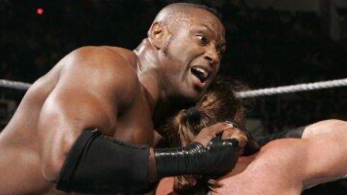 Marcus Cor Von with a wrestler in a sleeper on WWE ECW