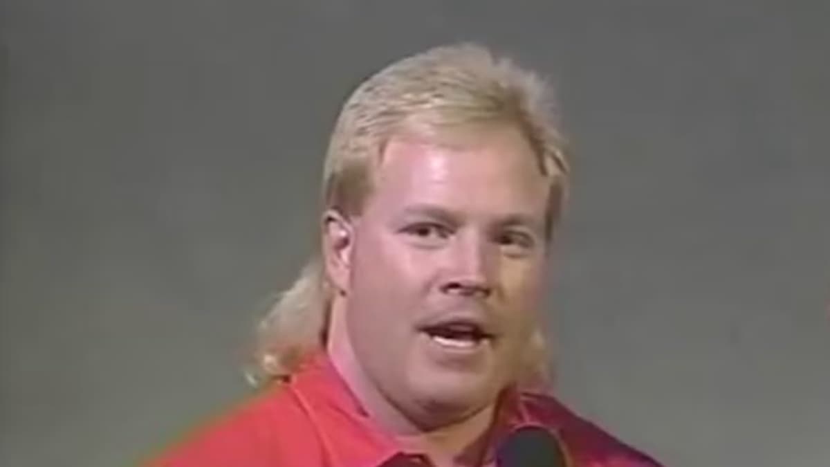 Tim Horner with blonde hair and a red jacket