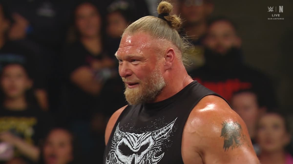 Brock Lesnar sweating profusely in a black vest