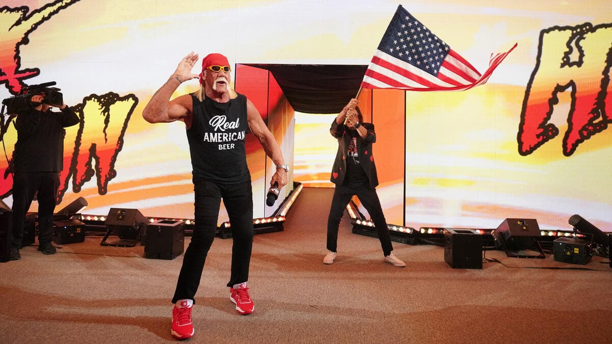 Hulk Hogan on WWE Raw with Jimmy Hart waving a US flag in the background