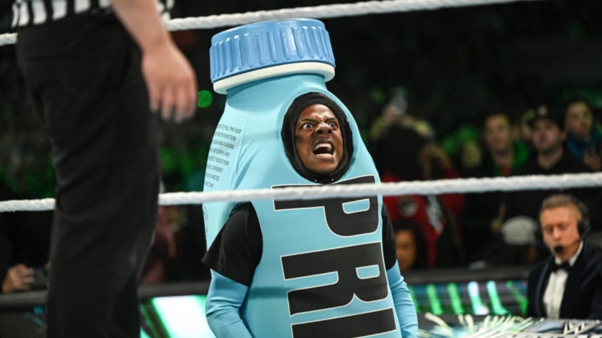 IShowSpeed in a giant Prime bottle grimacing ringside