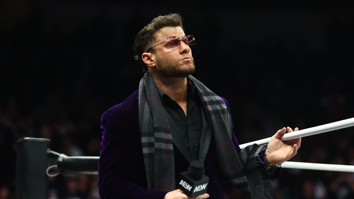 MJF on a March 2025 episode of Dynamite wearing red glasses and a black scarf