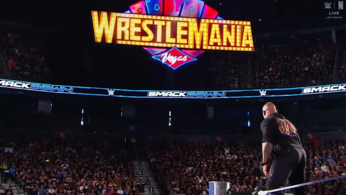 Randy Orton looking at the WrestlleMania sign