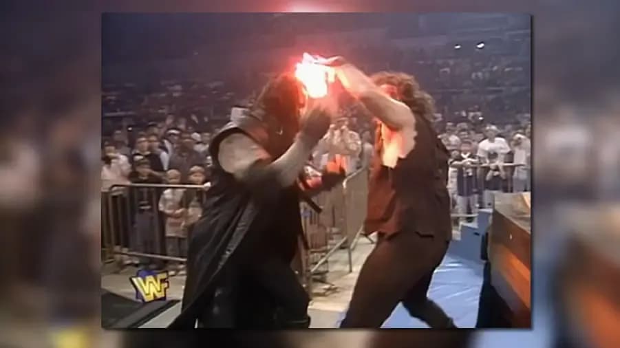https://cultaholic.com/files/images/3ef09583bdb82a1a18686c8f39cc3f1fed8696d4-the-undertaker-mankind-2.jpg