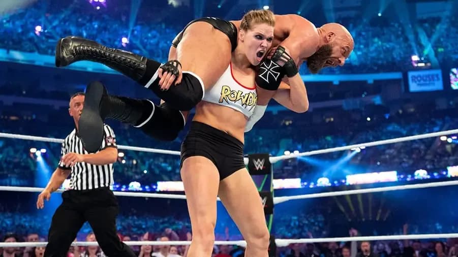 https://cultaholic.com/files/images/67c9b23eb68edd7e91f6336e9174605054d4dc80-ronda-rousey-triple-h-wrestlemania-34.jpg