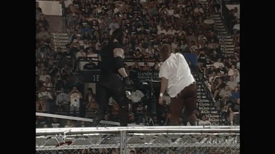 https://cultaholic.com/files/images/7ad4ce53331d33d00fa20a5c730ef2f841e407e8-king-of-the-ring-1998-the-undertaker-mankind-hell-in-a-cell.gif