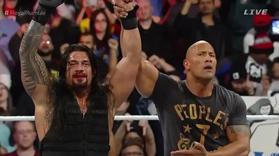 https://cultaholic.com/files/images/9eb2df012a308b930c4279173bd396c4873a6160-the-rock-roman-reigns-royal-rumble-2015-i.jpg