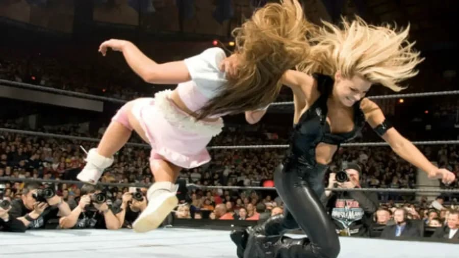 https://cultaholic.com/files/images/a438ec7b683655c14d352c11d9b03c57c7c83f76-trish-stratus-mickie-james-wrestlemania-.jpg