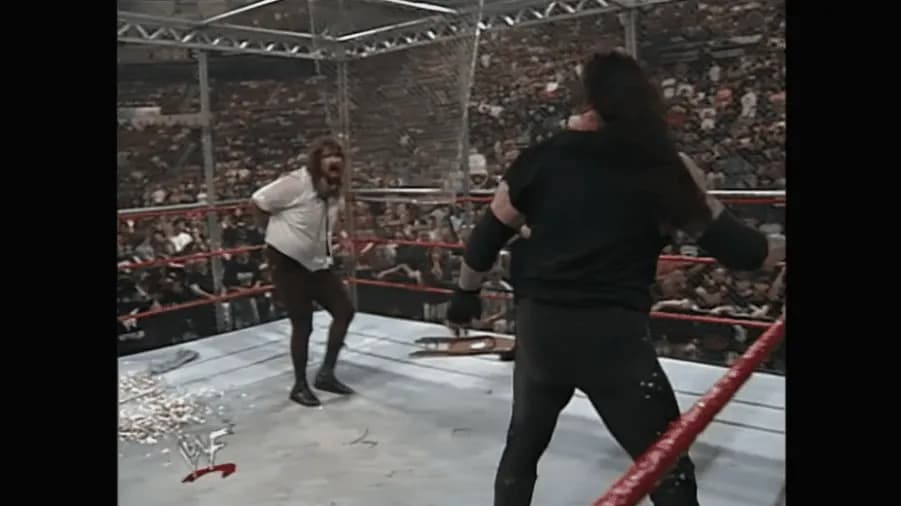 https://cultaholic.com/files/images/dc4ef3f5fc8b85fc4f441fe4b95b3d3f9a1db3ac-the-undertaker-mankind-hell-in-a-cell-king-of-the-ring-1998.gif